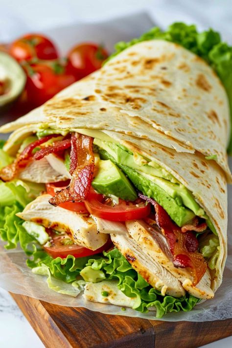 This easy chicken club wrap is the definition of delicious! With chicken, tomatoes, lettuce, avocado, bacon, and a creamy sauce, it's a classic sandwich in wrap form. Chicken Club Wrap, Club Wrap, Wraps Recipes Easy, Chicken Tomatoes, Wraps Recipes, Chicken Wrap Recipes, Chicken Club, Classic Sandwich, Cook Chicken Breast