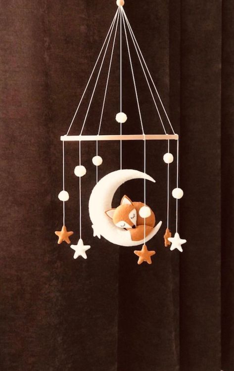 Handmade with love❤️ 🦊 With this charming mobile phone, your little treasure will plunge into the sweetest dreams.  Available in different colors and variants, a Mobilé transforms the nursery into a real sleeping space.  The product is characterized by the fact that each piece is handmade, so there may be occasional deviations.  🦊 Our felt mobile consists of sleeping fox,moon,stars and pompom.   🦊 Our mobile phones are also a great gift for a birthday present or baby shower party.   🦊 Size. Fox Mobile, Moon Stars Nursery, Forest Mobile, Fuchs Baby, Mobile Bebe, Baby Play Gym Toys, Fox Nursery Decor, Boho Mobile, Stars Nursery Decor