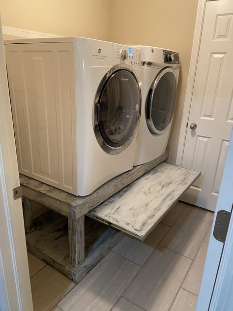 Elevated the washer and dryer so that I don’t have to break my back bending over... added pull out table to set basket onto... Washer Dryer Platform Ideas, Washer And Dryer Base, Laundry Room Design Pedestal, Washer And Dryer Enclosure, Shoe Storage Under Washer And Dryer, Washer And Dryer Pedestal With Pull Out Shelf, Wooden Washer And Dryer Pedestal, Washing Machine Pedestal Platform, Elevated Washing Machine And Dryer