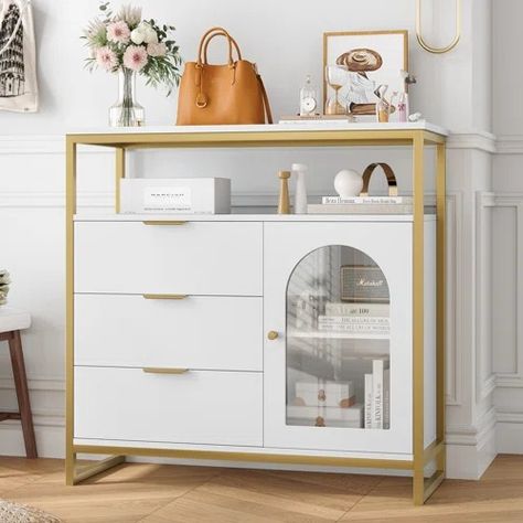 Willa Arlo Interiors Mathilda 7 Drawer 41.7" W, 37.5" H Dresser With Open Shelf | Wayfair 3 Tier Console Table, White And Gold Dresser, Gold Storage, Gold Dresser, Modern Storage Cabinet, Wooden Storage Cabinet, Comfortable Life, 3 Drawer Dresser, Tempered Glass Door