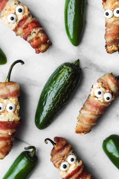 1 reviews · 20 minutes · Gluten free · Serves 1 · These bacon wrapped jalapeno popper mummies are an easy, fun and festive recipe idea to spice up your Halloween party! To make them: take jalapeno peppers, scoop out the seeds, stuff with cream cheese… More Keto Halloween, Bacon Wrapped Jalapeno Poppers, Candy Eyes, Bacon Wrapped Jalapenos, Roasted Jalapeno, Festive Appetizers, Poppers Recipe, Jalapeno Peppers, Stuffed Jalapenos With Bacon