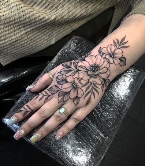 Around The Hand Tattoos, Hand Tattoo Idea For Women, Flowery Hand Tattoo, Simple Hand Tattoos For Women Unique, Full Hand Tattoo Women, Floral Wrist Hand Tattoo, Matching Tattoos On Hand, Small Floral Hand Tattoos, Witchy Hand Tattoo Ideas