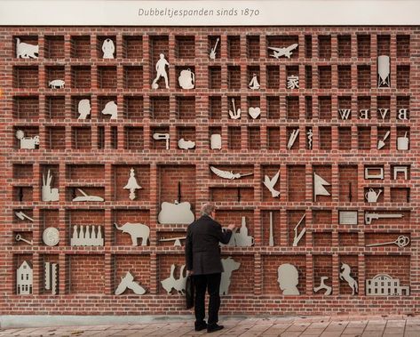 studio wessels boer transforms a blank brick wall into a magnified type case sculpture for an educational urban intervention. Natural Building Materials, Concrete Interiors, Brick Detail, Brick Art, Brick Architecture, Exposed Brick Walls, Brick Facade, Natural Building, Brick Patterns