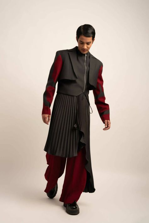 Made in IndiaMaroon trousers flow into wide legs, while the pleated skirt, worn as a luxurious wrap around the waist, adds a dynamic touch. A lavish ensemble fit for elite gatherings and sophisticated affairs.FabricsShell: TR Suiting, IndiaMaintenance• Dry Clean Only• Do Not Bleach• Steam Iron OnlyModel is wearing UK Size Medium, Height 181 cmXS: 36 inches (bust), 33 inches (waist), 38 inches (hips)S: 38 inches (bust), 35 inches (waist), 40 inches (hips)M: 40 inches (bust), 37 inches (waist), 42 Futuristic Corporate Fashion, Men’s Haute Couture, Guys In Skirts Fashion, Masculine Skirt Outfit, Men Skirt Outfits, 2000s Male Fashion, Interesting Suits, Male High Fashion, Unique Mens Fashion