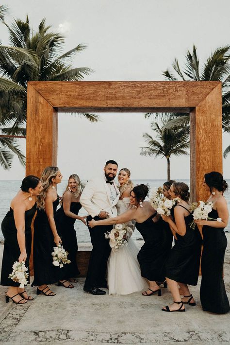 Beach wedding with the bridal party in black satin bridesmaid dresses Destination Bridesmaid Dresses, Black Satin Bridesmaid Dress, Bridesmaid Dress Inspiration, Beach Wedding Black, Beach Wedding Bridesmaid Dresses, Black Bridesmaid Dress, Beach Wedding White, Beach Wedding Bridesmaids, Destination Wedding Italy