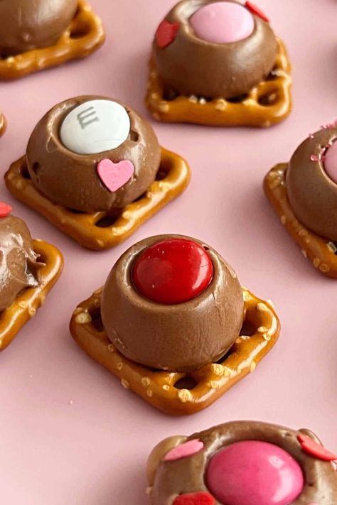 Rolo Pretzel Treats are pretzels topped with Rolos and M&M's candy and baked until slightly soft and gooey. An easy treat for Valentine's Day, Christmas or whenever you want a quick sweet and salty snack! Rollo Pretzels, Rolo Pretzel Treats, How To Make Pretzels, Rolo Pretzel, Bachelorette Party Food, Rolo Pretzels, Rolo Candy, Pretzel Treats, Pretzel Rolls