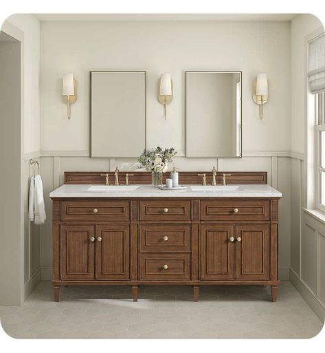 The 71 7/8" Lorelai Double Vanity celebrates timeless form and exquisite finish details, combined with practical function. The beauty of the natural grains in the walnut veneer is accented by reeded details, and clean, raised picture frame molding. The decorative, coin-edge knobs in Champagne Brass provide the perfect complement to the Mid-Century Walnut finish. This four-door cabinet opens to spacious interior with shelves and convenient USB/Electric power outlets. Three traditional drawers and Colonial Home Bathroom, Cherry Cabinet Bathroom Ideas, Bathroom Remodel With Storage, Wood Wainscoting Bathroom, Dark Wood Bathroom Cabinets, Bathroom Vanity Styling, Dark Vanity Bathroom, Master Bath Vanities, Double Vanity Bathroom Ideas