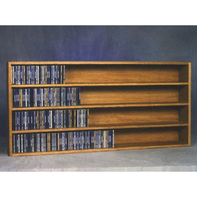 This rack is made with high attention to detail and quality. It is sure to enhance the appearance of any room. Solid oak is used for its strength and durability. This product can be placed either lengthwise or standing upright on a shelf, or mounted on a wall. This product looks great as it is solid wood and does not have any screws. Color: Dark Dvd Storage Solutions, Multimedia Storage, Diy Dvd Storage, Diy Dvd, Cd Wall, Cd Dvd Storage, Cd Rack, Music Storage, Ikea Wall