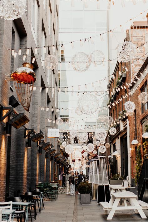 The Denver Milk Market is a lively food hall in the Lower Downtown and Ballpark area, close to Union Station. It have global food options, pastries, and a bar. Even if you’re only passing by, you have to snag some photos in the alley next door. The decorations are so cute. It’s lit up, and lanterns are strewn up above. Looking for more Colorado travel inspiration? Check out the ultimate list of things to do in Denver. | rockymountaindreaming.com #travel #inspiration #ideas #aesthetic #couples Denver Central Market, Milk Market Denver, Denver Milk Market, Denver Colorado Things To Do, Neo Architecture, Denver Colorado Aesthetic, Denver Aesthetic, Denver Bars, Bachelorette Aesthetic