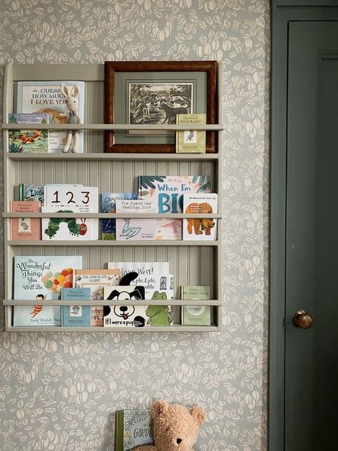 Books Nursery Storage, Prettyinthepines Nursery, Cork Board Nursery Ideas, Built In Bookshelf Nursery, Nursery When You Dont Know The Gender, Book Storage For Nursery, Book Shelf Nursery Ideas, Children Book Shelf, Nursery Peg Shelf