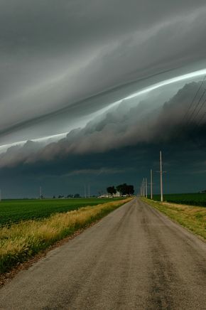 Stormy morning. The stadium effect. The eyewall of the hurricane curved ’round them like a bowl, like a stadium.  Photography by Rachel Gardner Weather Cloud, Storm Chasing, Matka Natura, Wild Weather, Belle Nature, Dirt Road, Storm Clouds, Alam Yang Indah, Natural Phenomena