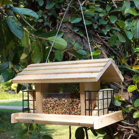 PRICES MAY VARY. [Premium Material]: Liawm wooden bird feeders are made of natural premium pine wood, which are very durable and built to withstand extreme weather conditions. [Large Capacity]: Our products measure 11x7x7.5 inches and can hold up to 2.3 pounds of birdseed, you can fill with a variety of birdseed to attract wild birds such as: sunflower seeds, peanuts, quinoa, corn kernels, etc.In addition to storing seeds, there are two suet cages on the side, and you can also put feed cakes for Storing Seeds, Modern Bird Feeders, Garden Roof, Pine Garden, Bird Feeder Plans, Wooden Bird Feeders, Wood Roof, Outdoor Decor Backyard, Bird Seed