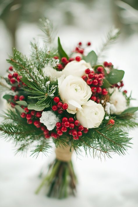 A winter wedding bouquet is a breathtaking blend of elegance and seasonal beauty. Burgundy flowers paired with icy blue tones and evergreen sprigs create a gorgeous contrast, while delicate white accents like snow-dusted pinecones and silver ribbons enhance the wintery feel. The bouquet mirrors the quiet beauty of the season, making it a perfect choice for the bride who wants to reflect the wonder of winter in her wedding celebration. Winter Wedding Bouquet Evergreen Bridesmaid, Winter Bridal Bouquet Greenery, Diy Christmas Wedding Bouquet, Winter Floral Arrangements Wedding, Red And White Winter Wedding, Wedding Bouquet Christmas, Winter Bouquets Wedding, Christmas Wedding Bouquets Bride, Small Wedding Bouquets Winter