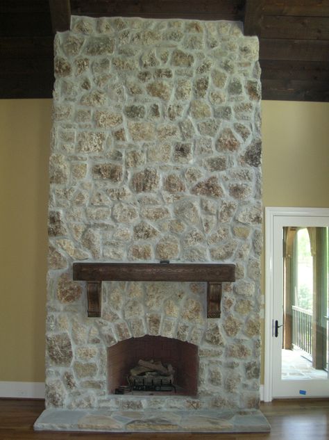 This is a great application of a stone that came from Oregon (I think), we used a dense overgrout and wipe over so that a smaller amount of the stone would show through. It's a very rustic stone. Fireplace Smear, Moss Rock Fireplace, Tuscan Stone Wall, Painted Rock Fireplaces, Painted Stone Fireplace, White Wash Fireplace, Stone Fireplace Makeover, Stone Fireplace Wall, Interior Paint Colors For Living Room