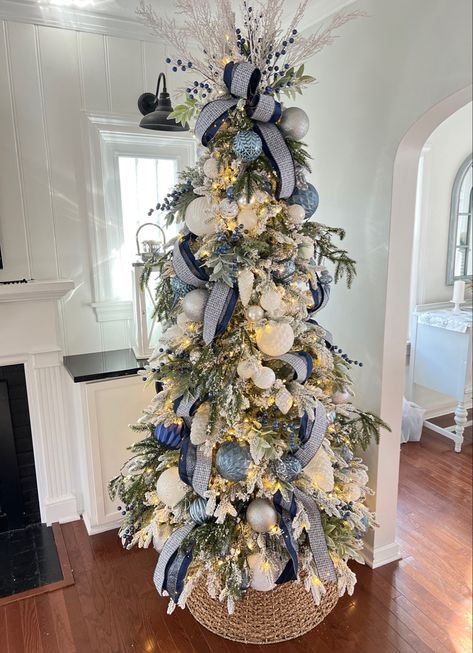 My Christmas Tree is now on sale !! Flocked Christmas tree. King of Christmas Queen Slim Flocked Blue ribbon, blue ornaments Follow my shop @beach_life_living on the @shop.LTK app to shop this post and get my exclusive app-only content! #liketkit #LTKSeasonal #LTKHoliday #LTKhome @shop.ltk https://liketk.it/3WLKs Flocked Coastal Christmas Tree, Hampton Christmas Tree, Decorated Flocked Tree Ideas, Blue And White Flocked Christmas Tree, Blue Champagne Christmas Tree, Hamptons Christmas Tree, Blue And Silver Flocked Christmas Tree, Christmas Tree Decorated In Blue, Downswept Christmas Tree Decorated