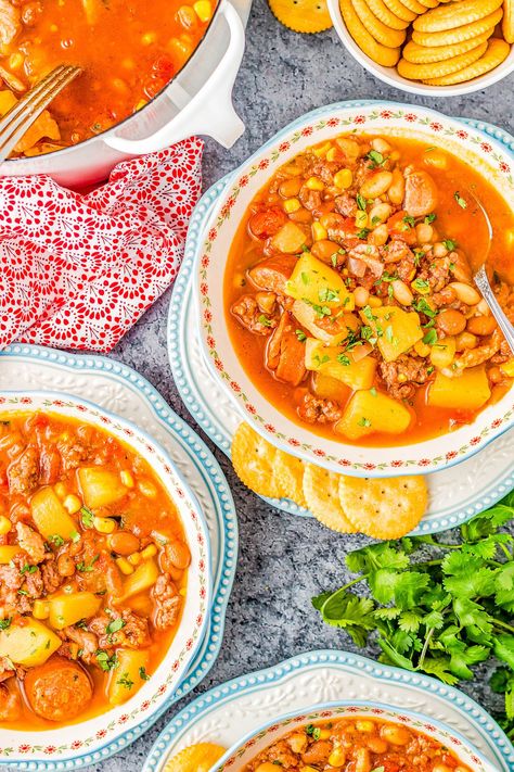 Cowboy Stew - All the cowboys, cowgirls, and meat lovers are going to LOVE this EASY stew recipe with ground beef, bacon, and sausage! There are also beans, potatoes, and corn simmered in a flavorful chili powder, smoked paprika, and cumin broth. Ready in 45 minutes, this is pure hearty comfort food that the whole family will enjoy! Bisque Recipes, Easy Stew Recipes, Honey Cornbread Muffins, Cowboy Stew, Texas Recipes, Bacon And Sausage, Potatoes And Corn, Recipe With Ground Beef, Beans Potatoes