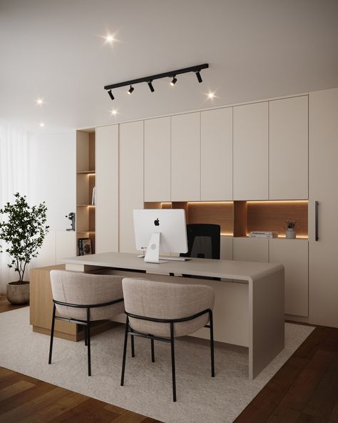 Main desk area of the modern office, emphasizing a clean, minimalistic, and professional design. A sleek, light-colored desk takes center stage, topped with an Apple computer, indicating a workspace set up for consultations or administrative tasks. Two comfortable, beige upholstered chairs with black metal frames face the desk, inviting clients or guests to sit and engage in discussions. Consultation Office Design, Consultation Office, Colored Desk, Desk Area, Desk Areas, Apple Computer, Private Office, Wellness Center, Metal Frames