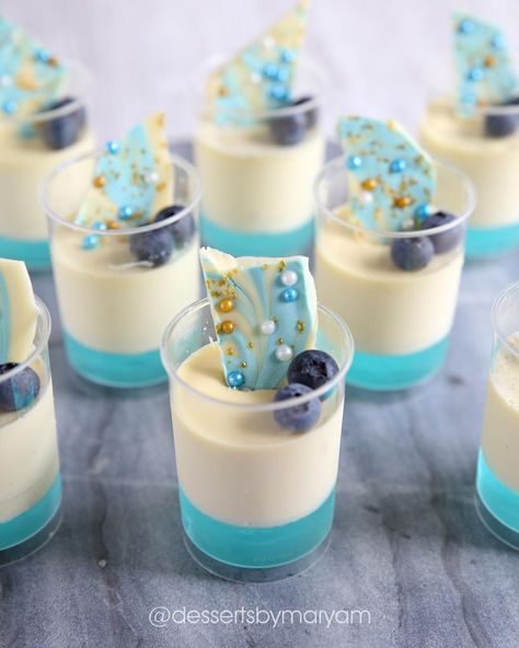 Vanilla bean Panacotta with blue jelly, topped with some white chocolate, blue and gold shards to go with the theme my customer was after.… Blue Party Desserts, Blue Dessert Ideas, Blue Dessert Table, Blue Candy Table, Ocean Cupcakes, Ocean Birthday Cakes, Wedding Food Stations, Mini Dessert Cups, Dessert Table Birthday