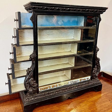 What an amazing piece!!! A very special 19th century ebonised cigarette shop display case!! With original gold foil advertising and fantastic carving! Measurements to follow. #antiqueshopdisplay #antiquecigarettecase #victorianshopdisplaycabinet #ebonisedantiques #antiquesforsale #coolinteriorswithantiques #cotswoldantiquedealers #wiltshireantiques Antique Jewelry Display, Antique Display Case, Antique Shop Display, Jewelry Display Case, Antiques For Sale, Shop Display, Jewelry Display, Display Cabinet, Display Case