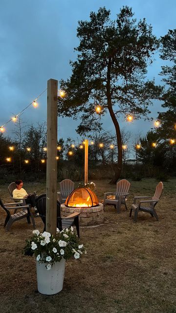 Fire Pit With Twinkle Lights, Fire Pit In Garden Ideas, Shed Fire Pit Area, Lighting Around Fire Pit, Fire Pit Hammock Ideas Backyard, Covered Fire Pit Ideas Backyard, Bond Fire Ideas Backyards, Bonfire Ideas Backyard Diy, Rustic Firepit Outdoor