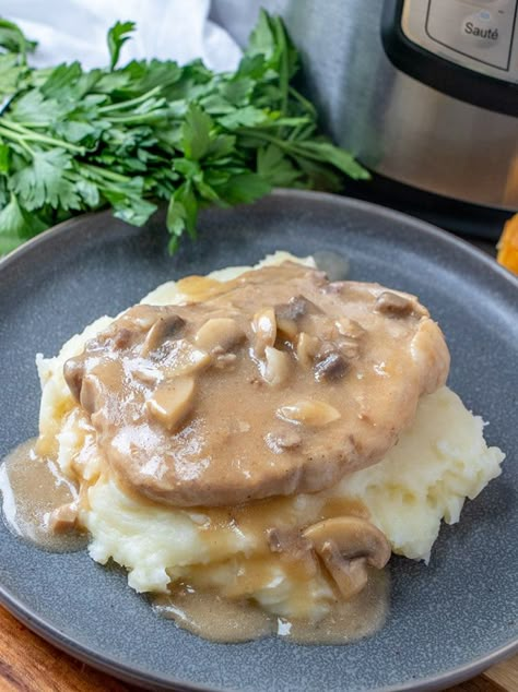 Instant Pot Pork Chops with Mushroom Gravy is the ultimate comfort food that's sure to be a family favorite. With fork-tender meat and a flavorful savory sauce ready in minutes, this pressure cooker pork chops are perfect for busy weeknights. Instapot Pork Chops, Pork Chops With Mushroom Gravy, Mushroom Soup Pork Chops, Pressure Cooker Pork Chops, Pressure Cooker Pork, Instant Pot Pork Chops, Mushroom Pork Chops, Smothered Pork Chops, Mushroom Soup Recipes