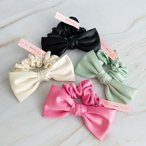 Our Satin Bow Tie Hair Scrunch is made from high quality satin, this scrunchie adds a charming and sophisticated detail to any hairstyle. Perfect for both casual and formal events, this scrunch is a must-have for a polished and stylish appearance.Dimensions: The bow is approximately 5.5" x 3" x 1"Made In: ChinaMaterial Composition: high quality satin Satin Scrunchies Aesthetic, Bow Tie Hair, Tie Hair, Hair Setting, Satin Bow, Scrunchie Hairstyles, Steel Jewelry, Headband Hairstyles, Hair Claw