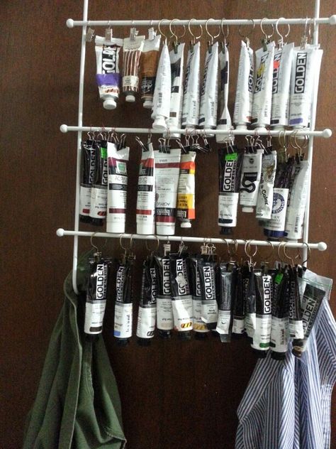 I love storing my tubes of paint this way.easy to see what I need! I used n over the door towel rack and bull dog clips and cafe curtain clips. Rangement Art, Art Studio Storage, Studio Storage, Art Rooms, Paint Organization, Curtain Door, Art Studio Space, Art Supplies Storage, Art Studio Organization