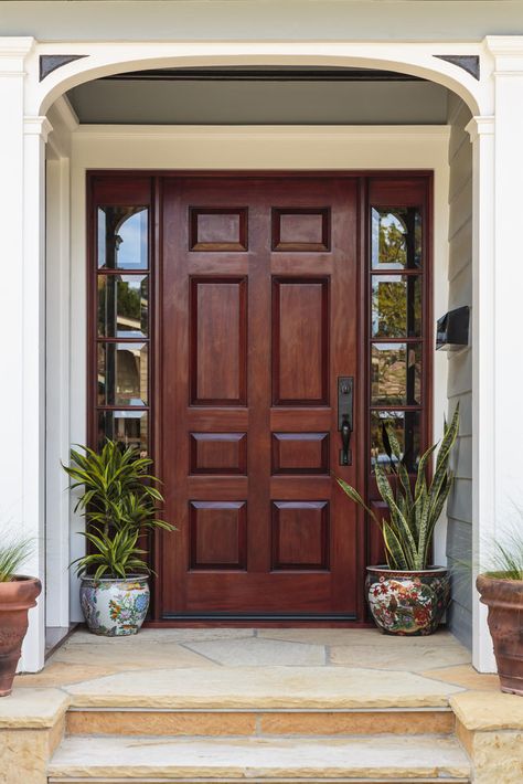 Flagstone entry stairs lead to this dark wood front door that's flanked by mirrored side panels. It is accented with a pair of hand painted ceramic pots. Wooden Front Doors, Wood Front Doors, Wooden Door Design, House Front Door, Main Door Design, Front Door Design, House Doors, घर की सजावट, Lhasa