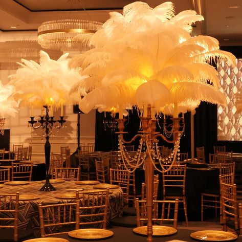 Great Gatsby-inspired parties are definitely some of the most popular events we set up our luxurious ostrich centerpieces, feather walls and feather towers at. ✨ • • • #greatgatsby #greatgatsbytheme #greatgatsbyparty #weddingdecor #weddinginspiration #weddinglosangeles #tablestyling #tablescape #tablecenterpiece #ostrichfeathers #ostrichfeathercenterpieces #feathercenterpiece #specialeventrentals #rentfeathers #roaring20s #oldhollywood Great Gatsby Wedding Centerpieces, Gatsby Table Decor, Feather Centrepiece, Gatsby Wedding Decor, Great Gatsby Prom Theme, Prom Theme Decorations, Ball Themes, Gatsby Wedding Decorations, Great Gatsby Party Decorations