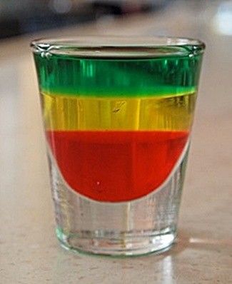 A delicious recipe for Bob Marley, with Midori melon liqueur, Jagermeister herbal liqueur and Goldschlager cinnamon schnapps. Bob Marley Drink, Jamaican Party, Jello Shot, Adult Drinks, Party Drinks, Destiel, Non Alcoholic Drinks, Non Alcoholic, Cocktail Drinks