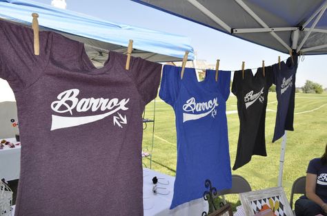 Hanging shirts for display!                              … How To Display Shirts For Sale Craft Fairs, Vendor Shirt Display, Tshirt Booth Display Ideas Vendor, Vendor Booth Display Ideas Clothing, Fair Booth Display Ideas, Vendor Booth Display Ideas, Clothing Booth Display, Vendor Table Display, Booth Display Ideas