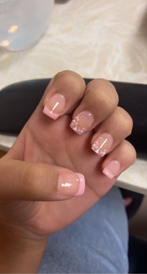 pink french tip nails, with some flowers!! Very Small Acrylic Nails, Nails With Flower Tips, Simple Spring Nails French Tips, Cute French Tip Nails Acrylic With Design, Natural Nails Pink Design, Short Square Flower Acrylic Nails, Cute Nails On Real Nails, Cute Short Nail Sets Pink French, Pink Nails Short With Design