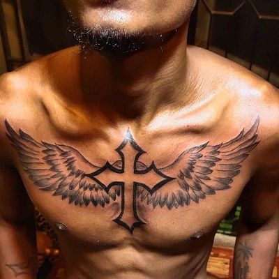 Latest 50 Men Angel Wings Tattoo Designs (2023) Full Chest Tattoo Design, Fallen Angel Back Tattoo, Chest Tattoo Angel, Angel Wings Chest Tattoo, Irish Cross Tattoo, Back Cross Tattoos, Cross With Wings Tattoo, Cross Tattoos For Men, Cross Tattoo Meaning