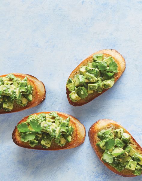 Avocado Bruschetta | There’s much more to this guacamole ingredient than its creamy texture. Here, diced avocado mixes with cilantro, scallions, lime and garlic and tops crisp grilled bread for an easy bruschetta appetizer. This versatile superfood fruit berry (yup) can also be used in dips, salads, smoothies, and even baked into brownies (just to name a few).  #food #recipe #cuisineathome #bruschetta #avocado #avocadorecipes #appetizers #appetizerrecipes #appetizerideas Avocado Bruschetta Recipe, Avocado Bruschetta, Bruschetta Recipes, Bruschetta Appetizer, Easy Bruschetta, Guacamole Ingredients, Crostini Appetizers, Grilled Bread, Watermelon And Feta