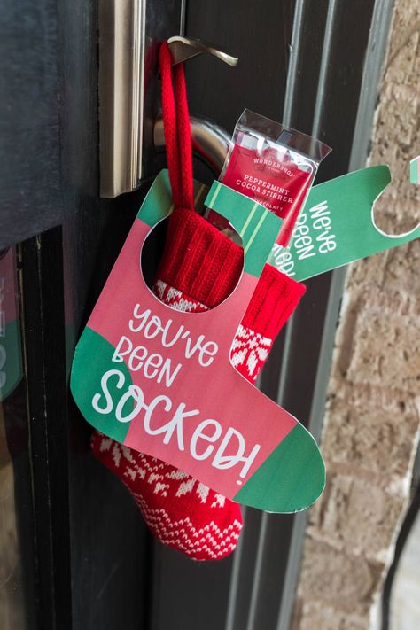 Secretly "sock" your neighbors and friends with the fun You've Been Socked Game. Learn how to play this gifting game filled with fun surprises. #YouveBeenSocked #GiftingGame #Christmasgames #Gift #DIYGame #Printable You Been Socked Christmas, Ladies Christmas Sock Exchange, You've Been Elfed Ideas Neighbor Gifts, Neighborhood Secret Santa Ideas, Secret Stocking Exchange, Xmas Socks Gift Ideas, Secret Pumpkin Gift Exchange, You’ve Been Socked Printable, Socks Gift Bow