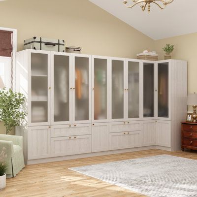 This spacious wardrobe armoire is a versatile storage solution for more oversized bedrooms or dressing areas. It features frosted glass doors that lend a high-end feel while concealing your belongings. Inside, you'll find three clothing rods with a 55 lbs. weight capacity, allowing you to hang various garments without deformation. The large drawers at the bottom glide smoothly on metal slides, making organizing smaller items like delicates easy. Open shelves provide space for jeans, T-shirts, sc Armoire Wardrobe Closet, Tidy Bedroom, Armoire D'angle, Wooden Closet, Corner Wardrobe, Large Wardrobes, 4 Door Wardrobe, Wood Armoire, Wardrobe Upgrade