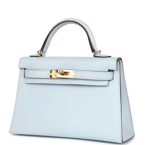 This Kelly, in the Sellier style, is in Bleu Brume epsom leather with gold hardware and has tonal stitching, two straps with front toggle closure, single rolled handle and removable shoulder strap.The interior is lined with Bleu Brume lambskin leather and has one open pocket on the back wall.Collection: YOrigin: FranceCondition: New and never worn (plastic on hardware)Accompanied by: Hermes box, Hermes dustbag, shoulder strap, shoulder strap dustbag, feltMeasurements: 7.5" width x 4.5" height x 2.2" depth; 2.5" handle drop (18" shoulder strap drop) Blue Birkin, Hermes Collection, Hermes Kelly Sellier, Kelly Sellier, Mini Kelly, Blue Handbag, Hermes Kelly Bag, Girly Bags, Hermes Box