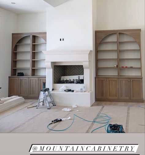 Arched Bookshelf Next To Fireplace, Curved Built Ins Around Fireplace, Fireplace Built Ins With Arches, Built In Cabinet With Arch, Black Arched Built Ins, Round Top Built In Bookcase, Display Cabinet Next To Fireplace, Arch Bookshelf Fireplace, Built In Shelves Living Room Tall Ceilings