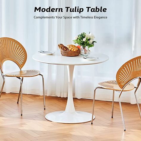 #MODERN #DINING TABLE: This round #tulip table from Vonluce offers a comfortable and #stylish #dining experience for up to 6 people, perfect for #intimate meals, family #gatherings, and friend reunions. ELEGANT STYLE: With its matte white finish, our small pedestal table adds class to your #home #decor, seamlessly blending with a variety of interior styles from #modern #minimalist to #coastal. Bistro Table Kitchen, Small Pedestal Table, Modern Square Dining Table, Mid Century Kitchen Table, Square Dining Room Table, Modern Bistro, Table For Dining Room, Tulip Dining Table, Tulip Table