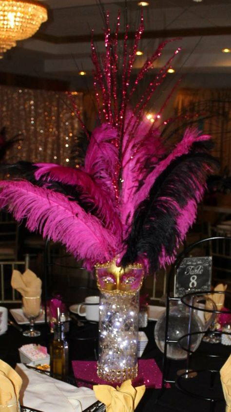 Masquerade Centerpiece by mimisballoonextravaganza Colorful Masquerade Party Decorations, Carnival Masquerade Party, Cabaret Centerpieces, Sweet 16 Masquerade Party Decorations, Mascarade Decorations, Masquerade Centerpiece Ideas, Diy Masquerade Decorations, Masquerade Centerpiece, Masquerade Party Centerpieces