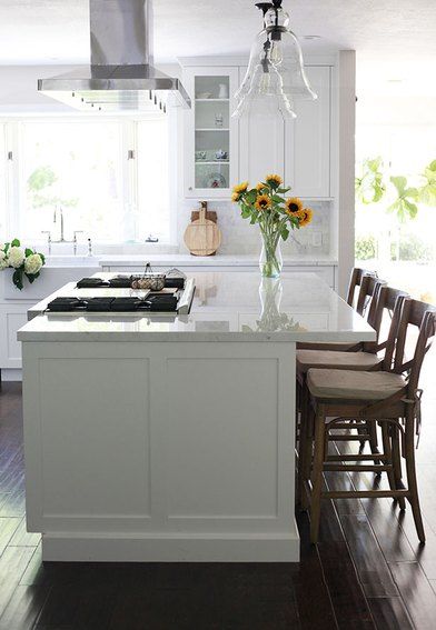 Kitchen Island With a Stove: Ideas and Inspiration | Hunker Kitchen Island With Cooktop, Island With Stove, Kitchen Island With Stove, Island Cooktop, Kitchen Peninsula, White Marble Kitchen, Kabinet Dapur, Kitchen Open, Diy Kitchen Renovation