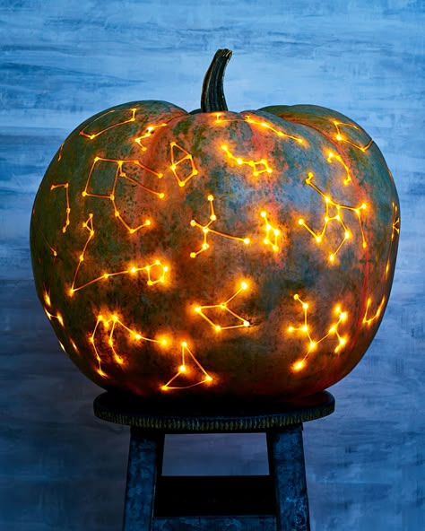 The Galaxy Pumpkin Trend That's Out of This World | Deciding how to decorate your pumpkins can be difficult-there's so many options! This constellation pumpkin will wow the trick-or-treaters at your doorstep. Look to the stars for decorating inspiration!    #halloween #pumpkins #marthastewart #pumpkincarving Halloween Pumpkin Stencils, Creative Pumpkin Carving, Pumpkin Carving Designs, Beautiful Pumpkins, Easy Halloween Decorations, Jack O'lantern, Creative Pumpkins, Zucca Halloween, Pumpkin Stencil