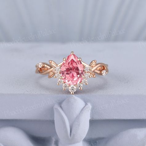 Vintage peach sapphire engagement ring delicate pear pink sapphire wedding ring solid gold rings unique handmade gift anniversary gift women PRODUCT SUMMARY Metal Type: yellow, white or rose solid 10K/14K or 18K gold. Size: All sizes are available, contact me if they do not contain the size you want in the drop-down menu. ☪☪Engagement ring ⚜Center Stone - lab grown pink paparacha sapphire Cut - pear Size - 6x8mm,about 1.3 ct ⚜Side Stone - Moissanite or diamond Cut - Round Weight - 0.185ct Clarit Unique Engagement Rings Pink, Pink Saphire Engament Ring, Pink Rings Engagement, Unique Rose Gold Engagement Rings, Pink Sapphire Wedding Ring, Wedding Rings Pink Sapphire, Fairytale Engagement Rings, Pink Rings, Engagement Ring Delicate