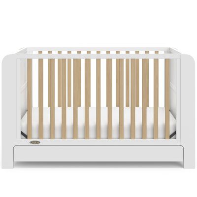 Transform your nursery with the Graco Read-with-Me 4-in-1 Convertible Crib with Drawer, featuring two detachable bookshelves that adapt to your child's growing stages. These versatile bookshelves continue to organize your little one's books even after they outgrow the crib, making it a lasting addition to any space. Crafted from pine wood and engineered wood, the Read-with-Me meets ASTM and CPSIA safety standards, providing peace of mind for parents. JPMA Certified, it undergoes rigorous testing by accredited laboratories to exceed safety standards. Engineered to grow with your baby, the Read-with-Me features an adjustable mattress support base with four height options, ensuring safety and comfort as your child grows up to 35 inches in height or can climb out independently. The Read-with-M Adjustable Mattress, Mattress Support, Convertible Crib, 6 Drawer Dresser, Drawer Dresser, All Modern, Engineered Wood, Cribs, Bookshelves