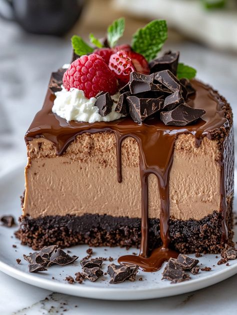 Triple Chocolate Mousse Cheesecake 🍬  🍬  Ingredients 🍬 For the crust: 1/4 cup unsalted butter, melted 🧈 2 cups Oreo crumbs 🍪 For the cheesecake: 1 cup semi-sweet chocolate chips, melted 🍫 1 cup sour cream 🥄 24 oz (680g) cream cheese, softened 🧀 1 teaspoon vanilla extract 🍦 1 cup granulated sugar 🍬 2 tablespoons cocoa powder 🍫 3 large eggs 🥚 For the chocolate mousse: 1/4 cup powdered sugar 1 1/2 cups semi-sweet chocolate chips 2 cups heavy cream, divided 🥛 1 teaspoon vanilla extract 🍦 Best Chocolate Cheesecake, Triple Chocolate Mousse, Chocolate Mousse Cheesecake, Mousse Cheesecake, Cheesecake Ingredients, Best Chocolate Desserts, Chocolate Raspberry Cake, Chocolate Chip Cheesecake, Chocolate Egg