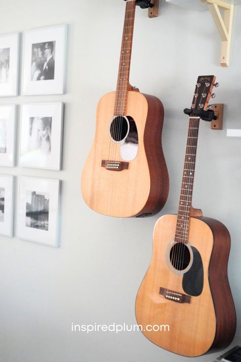 Check out our living room acoustic guitar display for tips to hang your instruments and decorate your space. Click to see how we've decorated our home with multiple guitars, mandolins, and a piano! Acoustic Guitar Display, Living Room Music Decor, How To Display Guitars On Wall, Guitar In Bedroom Aesthetic, Music Room Guitar, How To Hang Guitars On The Wall, Display Guitars On Wall, Guitar Wall Mount Ideas, Country Music Bedroom