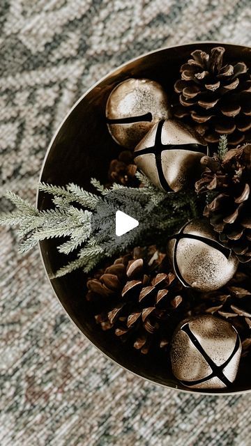 Steph Fischer | OFFISCHERLY HOME on Instagram: "DIY Holiday Bowl Filler ✨ I love using these #gifted brass hammered bowls in my decor year round and wanted to incorporate them into my holiday decor. 

It’s so easy to create beautiful filler! I used some clippings from an old greenery stem as my base and added pinecones and bells on top. For the smaller bowl, I simply just added pinecones. It’s that simple and beautiful! 

Want to shop my home? You can follow me on the @shop.LTK app / link in bio 🤍 and always feel free to shoot me a DM! 

#pokoliving #pokopartner #christmasdecor #holidaydecorating #diychristmasdecor #diyhomedecor #neutralchristmas #makehomematter #christmasdecorating #ltkholiday #ltkhome #howyouhome" Decor Bowl Filler Ideas, Christmas Bowl Fillers Ideas, Ornaments In Bowl, Christmas Bowl Fillers, Decorative Bowl Filler, Holiday Bowl, Christmas Bowl, Diy Bowl, Winter Decorations