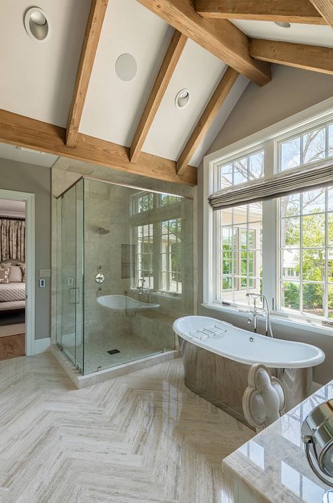 Bathroom with vaulted beamed ceiling and large herringbone floor tiles. The large herringbone floor tiles were supplied by Walker Zanger. bathroom-vaulted-beamed-ceiling #bathroom #vaultedceiling #vaultedbeamedceiling #largeherringbonetile Allan Edwards Builder Inc Herringbone Floor Tiles, Transitional French Country, French Country Interiors, Ideas Baños, French Country Bathroom, Best Modern House Design, French Country Bedrooms, Country Bathroom, Herringbone Floor