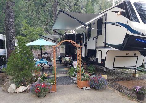 A longtime RVer is hanging up his keys and settling down in a permanent location due to RVing costs going up and campsites being more crowded. Campsite Decorating Ideas, Outdoor Screen Room, Campsite Decorating, Campsite Setup, Decorating Your Rv, Camping Picnic Table, Rv Exterior, Rv Campsite, Outdoor Projector