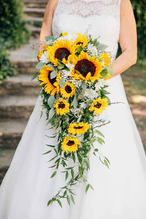 Sunflower And Green Wedding Bouquet, Sunflower Bride Bouquet, Sunflower Wedding Hairstyles, Sage Green And Sunflower Bouquet, Wedding Hairstyles With Sunflowers, Sunflower Cascade Bouquet, Sunflowers And Eucalyptus Wedding, Creekside Wedding Ceremony, Bride Bouquets Sunflowers